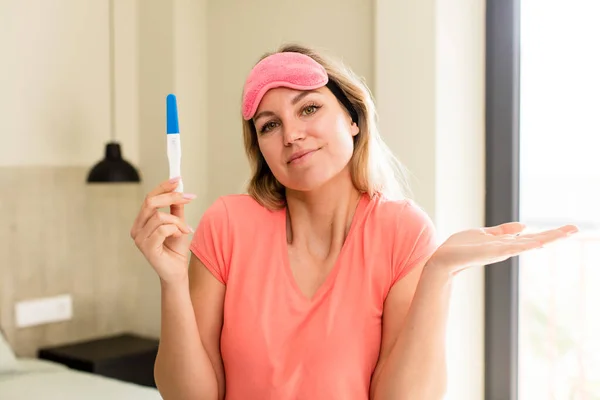 pretty young woman with a pregnancy test. house interior design