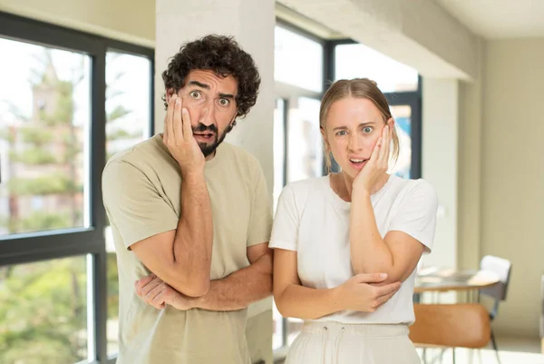 Young Adult Couple Open Mouthed Shock Disbelief Hand Cheek Arm — Stock Photo, Image