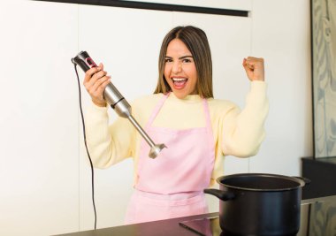 pretty latin chef woman cooking at home