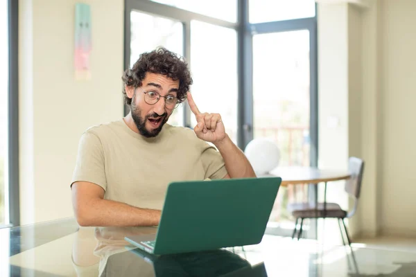 Young Adult Bearded Man Laptop Looking Surprised Open Mouthed Shocked — Stock Photo, Image