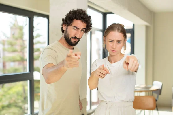 Young Adult Couple Pointing Forward Camera Both Fingers Angry Expression — Stock Photo, Image