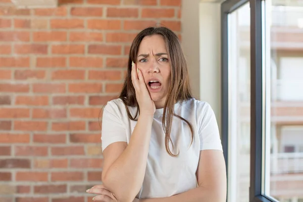 Young Adult Pretty Woman Open Mouthed Shock Disbelief Hand Cheek — Fotografia de Stock