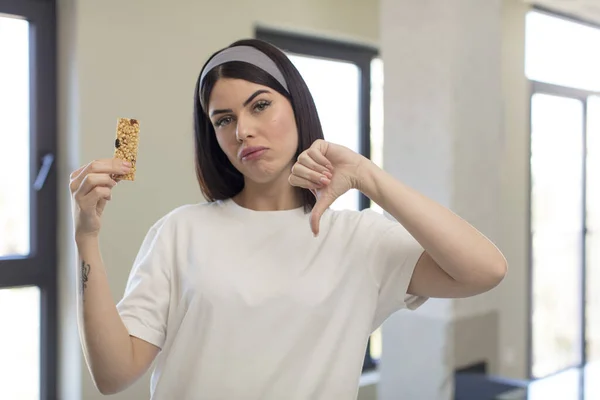 Pretty Young Woman Feeling Cross Showing Thumbs Fitness Cereal Bar — Stock Photo, Image
