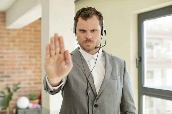 Looking Serious Showing Open Palm Making Stop Gesture Telemarketer Concept — Zdjęcie stockowe