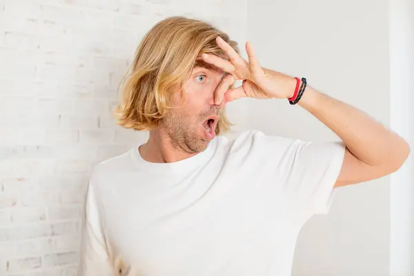 Young Blond Adult Man Feeling Disgusted Holding Nose Avoid Smelling — Stock Photo, Image