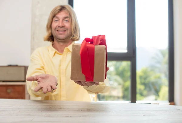 Young Adult Caucasian Man Smiling Happily Offering Showing Concept Gift — Stock Photo, Image