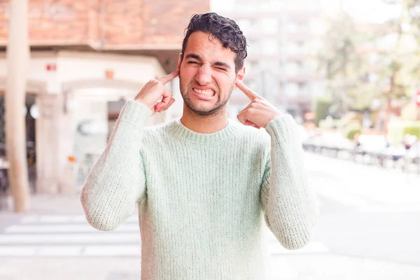 Young Hispanic Man Looking Angry Stressed Annoyed Covering Both Ears — Stock Photo, Image