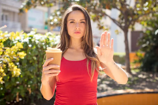 Pretty Woman Looking Serious Showing Open Palm Making Stop Gesture — 图库照片