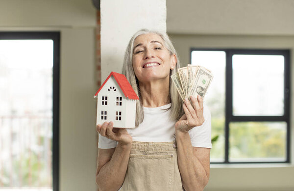 model holding a house. home concept