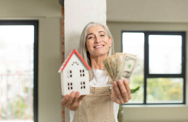 model holding a house. home concept