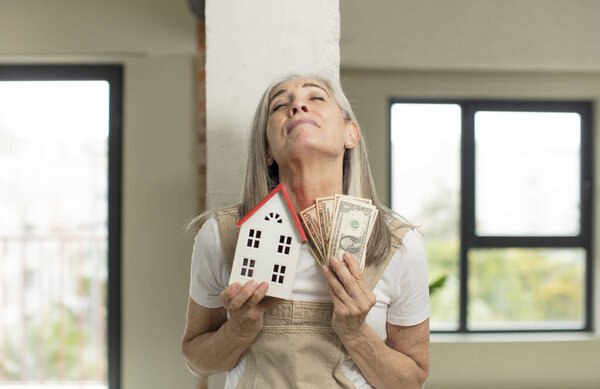 model holding a house. home concept