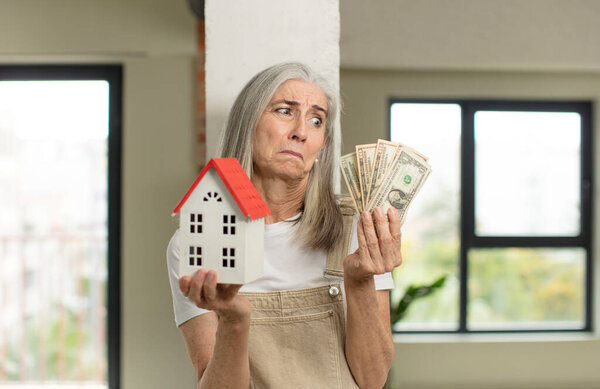 model holding a house. home concept