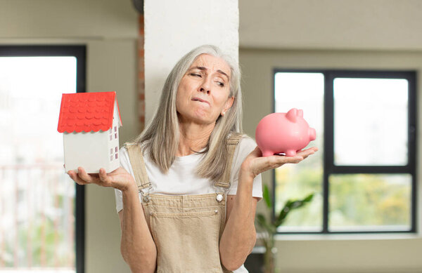 model holding a house. home concept