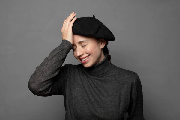 laughing and slapping forehead like saying doh I forgot or that was a stupid mistake