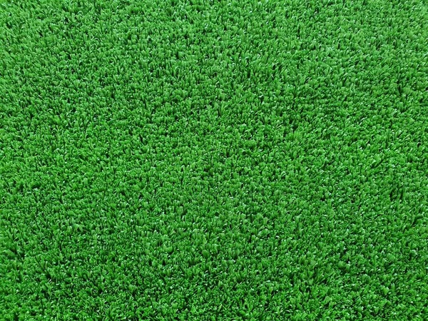 人工芝は合成繊維で作られた表面です 天然芝を交換するために本物の芝でプレーされるスポーツフィールドによく使われるタフで柔軟性があります ロイヤリティフリーのストック写真