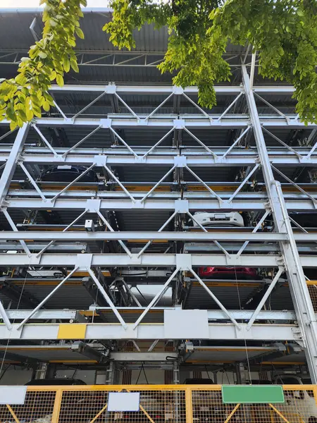 CAR PARK LIFT is a system for lifting cars up and down between floors of a building using an elevator. It has a strong structure suitable for buildings with insufficient space.