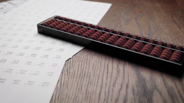 An abacus with numbers for mathematical calculations.