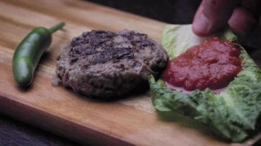 Round grilled sausage close-up.