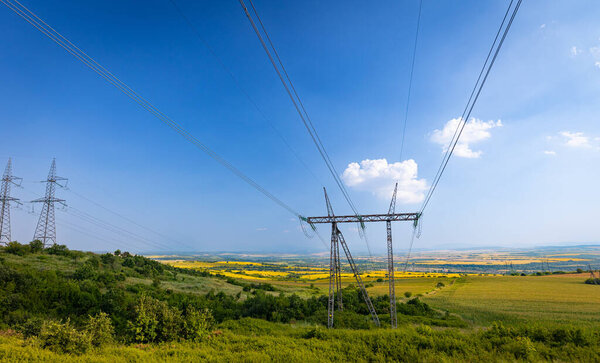 Bulgarian landscape with electricity power grid lines in the middle