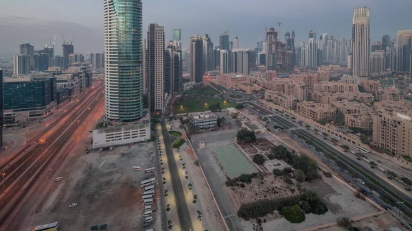 Dubajska Zatoka Biznesowa Wieże Lotnicze Noc Dniu Przejścia Timelapse Panoramiczny — Zdjęcie stockowe