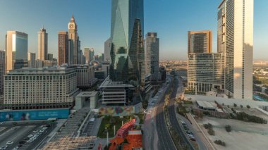 Panorama showing Dubai International Financial district aerial . View of business and financial office towers. Skyscrapers with hotels and shopping malls near downtown