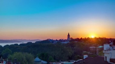 Beautiful Sunrise over Istanbul from top with Bosphorus Bridge and Topkapi Palace Museum timelapse. Istanbul - Turkey. Aerial view from sultanahmet downtown at clear spring morning