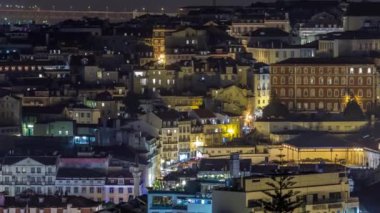 Lisbon aerial overview of city centre with illuminated buildings and rooftop terrace at night timelapse, Portugal. Top view from Sophia de Mello Breyner Andresen viewpoint