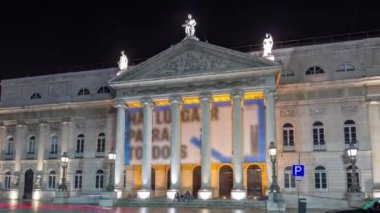 Rossio square in front of the illuminated National Theater Dona Maria II night timelapse hyperlapse in the capital of Portugal. Lisbon