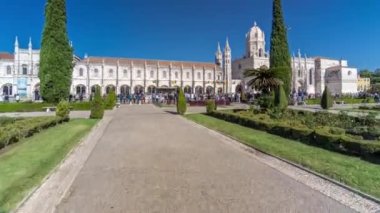 Hieronymites Monastery Mosteiro dos Jeronimos located in the Belem district of Lisbon timelapse hyperlapse, Portugal. View from the Imperio garden. Typical example of the Manueline style