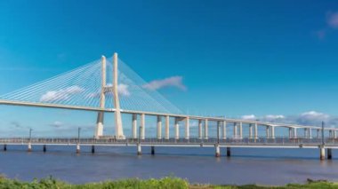 The Vasco da Gama Bridge timelapse hyperlapse. Cable-stayed longest bridge flanked by viaducts and rangeviews that spans the Tagus River in Park of Nations in Lisbon, the capital of Portugal