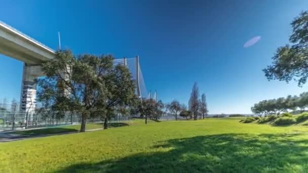 Vasco Gama Bridge Timelapse Hyperlapse Viewed Green Lawn Trees Cable — Vídeo de Stock
