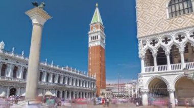 Campanile di San Marco St Marks belfry and Palazzo Ducale Doges Palace, from waterfront timelapse hyperlapse, Venice, Italy. Columns of San Marco and San Todaro. Blue cloudy sky at summer day