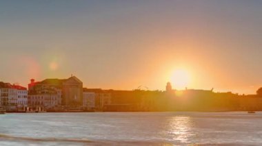 Sunrise at Grand canal over San Marco square timelapse. View from Church of Santa Maria della Salute, Venice, Italy, European Union. Famous historical heritage. Reflection on water