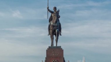 Monument of the Croatian King Tomislav timelapse hyperlapse and art pavilion in colorful park, in Zagreb, capital of Croatia. Blue cloudy sky before sunset. Close up view