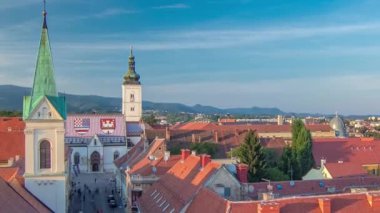 Church of St. Mark timelapse and parliament building Zagreb, Croatia. Top view from Kula Lotrscak tower viewpoint before sunset