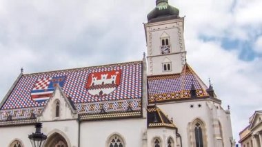Church of St. Mark timelapse hyperlapse and parliament building in downtown Zagreb, Croatia. Cloudy sky
