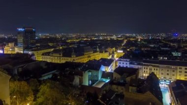 Old town of Zagreb at night timelapse. Zagreb, Croatia. Top panoramic view from Kula Lotrscak tower viewpoint with illuminated square