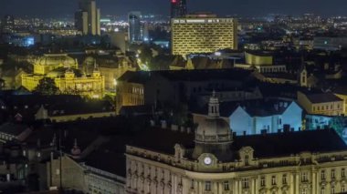 Old town of Zagreb at night timelapse. Zagreb, Croatia. Top panoramic view from Kula Lotrscak tower viewpoint with illuminated buildings