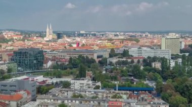 Panorama of the city center timelapse, Zagreb capital of Croatia, with modern and historic buildings, museums in the distance. Top aerial view from skyscraper