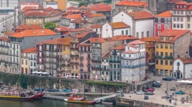 Beautiful view of the Douro River waterfront timelapse and the historic centre of Porto city in Portugal from above at summer time. Porto is a popular tourist destination in Europe.