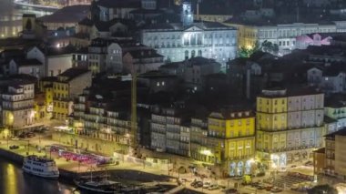 Beautiful night view of the Douro River illuminated waterfront timelapse and the historic centre of Porto city in Portugal at summer time. Porto is a popular tourist destination in Europe.