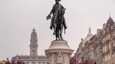 Liberdade square with monument of King Peter IV and Porto city hall, timelapse hyperlapse close up view at cloudy day, Porto, Portugal