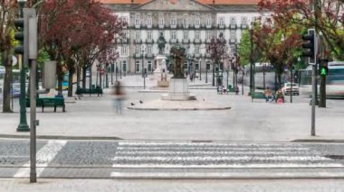 The Liberty Square in the historic centre of Porto timelapse. Zebra crossing over the road. Porto is one of the most popular tourist destinations in Europe.