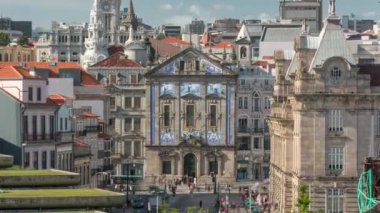 Almeida Garret Square with the Sao Bento railway station and Congregados Church at the back timelapse, Porto, Portugal. Traffic on intersection in front of the building