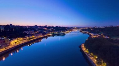 Aerial panoramic view before sunrise at the most emblematic area of Douro river timelapse night to day transition. World famous Porto wine production area.