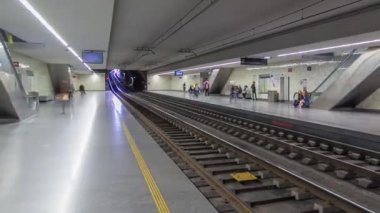 Tram in the underground staion in Porto, Portugal timelapse. Porto Metro first line of the system. People waiting for the train on a platform