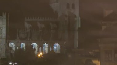 The crossroads near the Sao Bento Railway Station and Porto Cathedral night timelapse hyperlapse. The building of station is a popular tourist attraction of Europe.