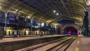 Trains departing at the platform of Sao Bento Train Station timelapse in Porto, Portugal. Built in 1916, this station is important transportation network and famous landmark.