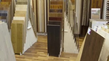 Top samples of various color palette - wooden floor timelapse stop motion. Camera moves in storefront hyperlapse