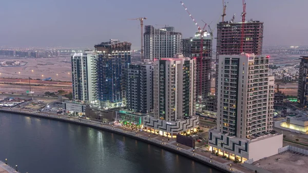 Πύργοι Στο Business Bay Εναέρια Μέρα Νύχτα Μετάβαση Στο Ντουμπάι — Φωτογραφία Αρχείου